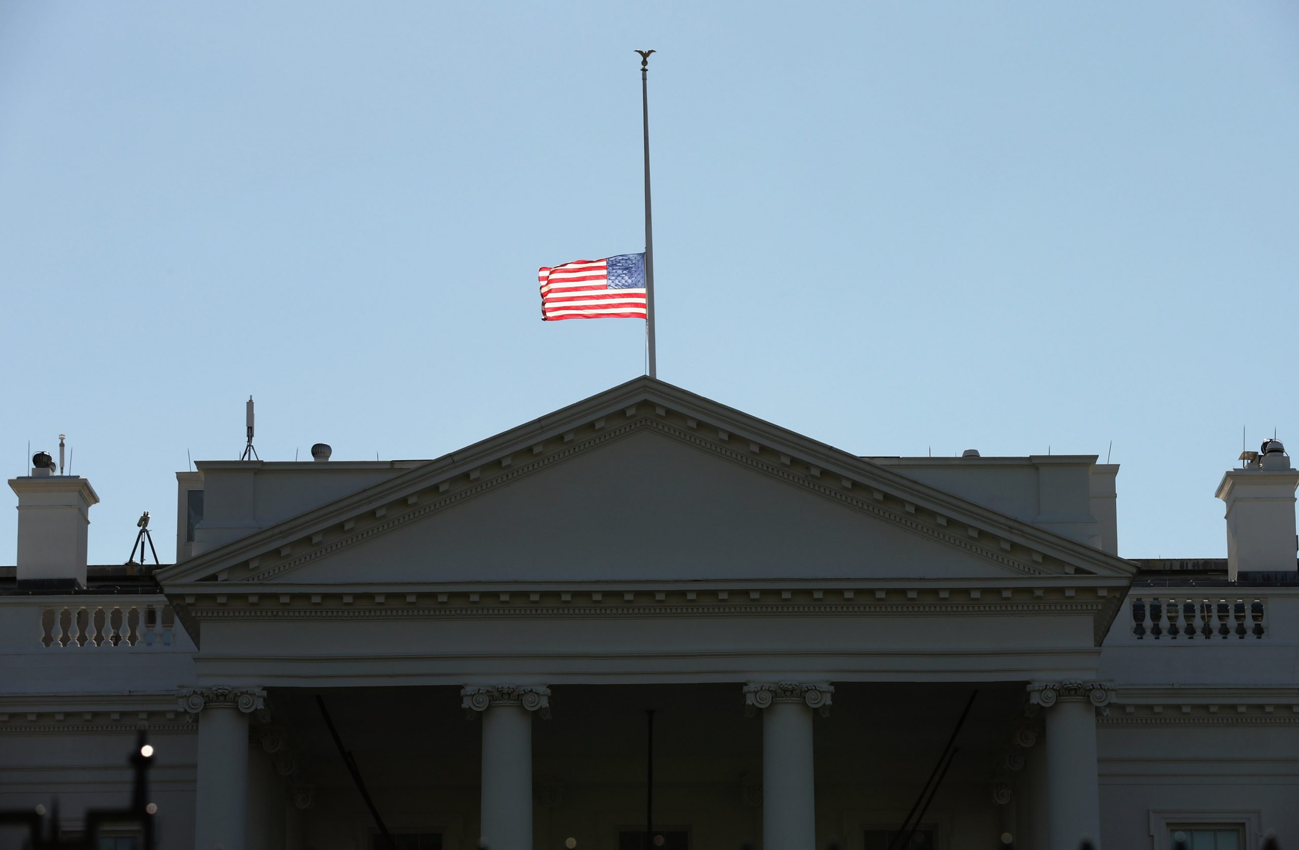 The American flag flys at half-staff above the White House December 3, 2015 in Washington, DC. U.S. President Barack Obama signed a proclaimation ordering all flags to be flown at half-staff to honor the victims of Wednesday's mass shooting in San Bernardino, California. (Photo by Chip Somodevilla/Getty Images)