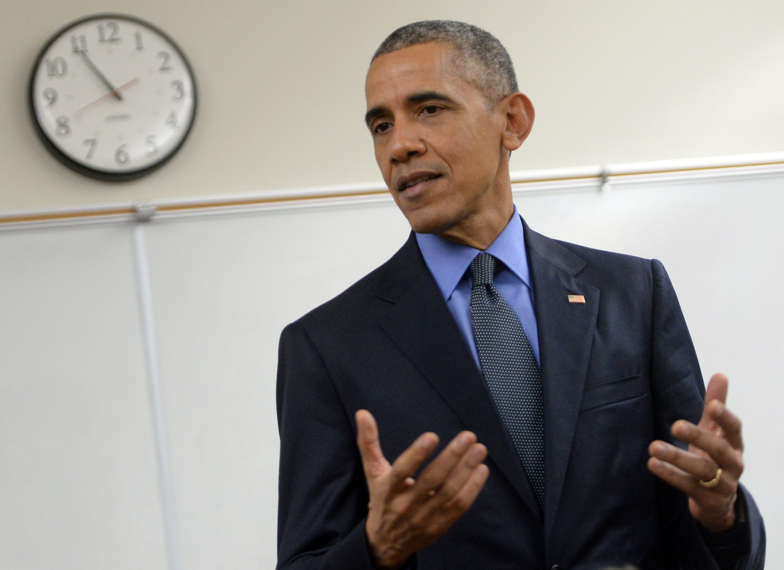resident Barack Obama makes a brief statement in a classroom at Indian Springs High School Friday evening December 18, 2015. The President and the First Lady met with family members of those killed during a mass shooting that left 14 dead at the Inland Regional Center in San Bernardino Dec. 2.(POOL PHOTO Will Lester/San Bernardino Sun)