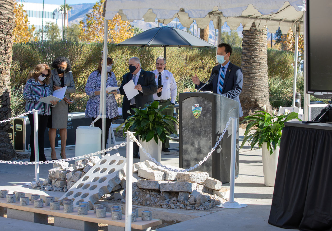 CEO Leonard Hernandez speaks at the podium during the Memorial Concept Unveiling
