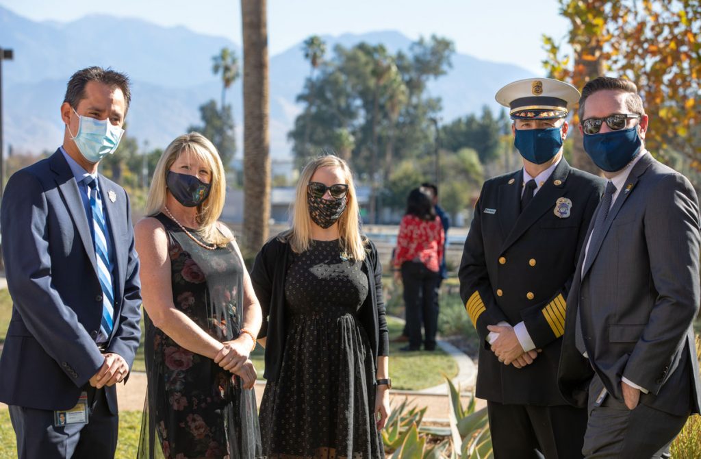 CEO Leonard Hernandez poses with Supervisor Dawn Rowe and three others at the Curtain of Courage Memorial Concept Unveiling