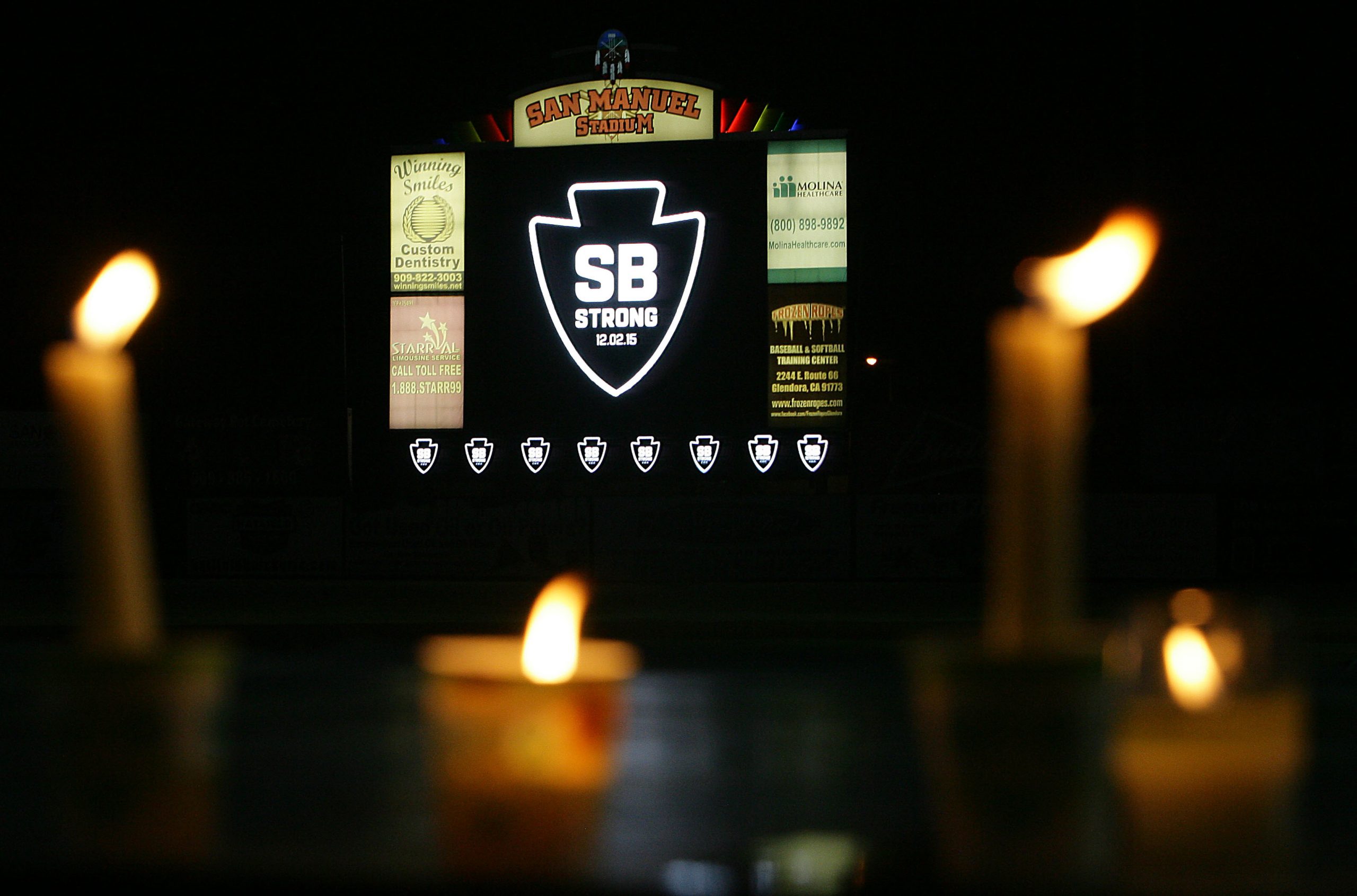 A candle light vigil for the victims of yesterdays mass shooting at the Inland Regional Center is head at San Bernardino's San Manuel Stadium in San Bernardino Thursday, Dec. 3, 2015. - The Press-Enterprise
