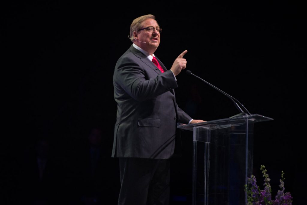 Pastor Rick Warren speaks on stage at the County Family Gathering